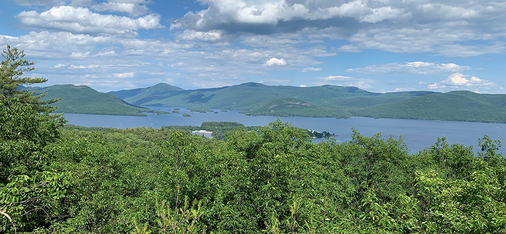 A scenic overlook of Bradley's Lookout in the Adirondack Mountains, offering stunning views of Lake George and the surrounding mountains.