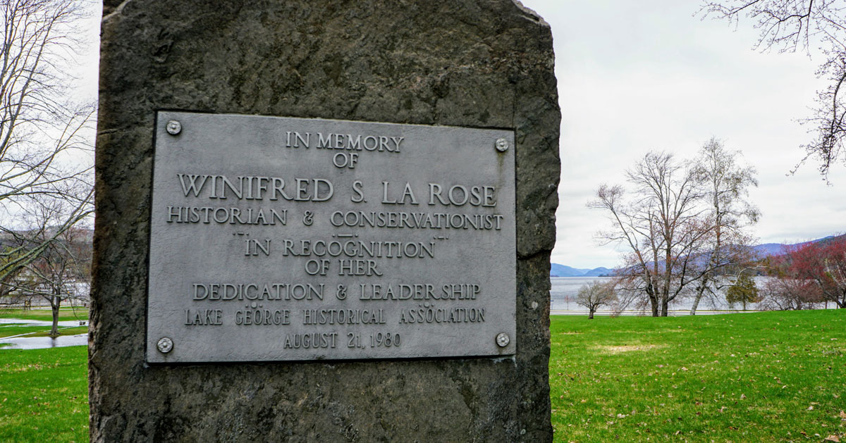 A plaque in Lake George Battlefield Park recognizes Winnie LaRose's impact as an historian and conservationist.